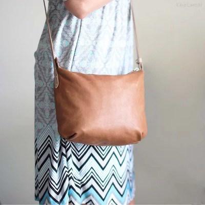 Borla. Tan wood lamb crossbody purse